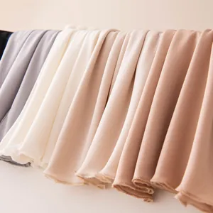 Selection of assorted silk face masks in neutral colors for breathable sun protection and comfort
