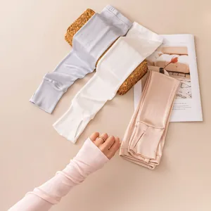 Detail view of women's silk sun protection arm sleeves in multiple colors