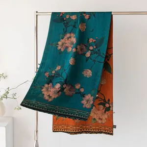 Elegant luxury dual-sided silk scarf featuring vintage floral patterns in teal and orange colors