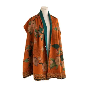 Luxurious double-sided floral silk shawl with toggle closure in orange and green