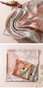 Detailed view of luxury double-sided printed silk square scarf with floral patterns