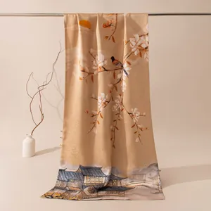 Close-up of a luxurious silk scarf featuring traditional Chinese magnolia and bird prints