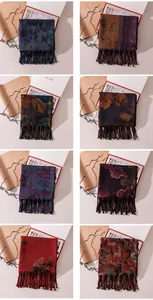 Close-up detail showing a variety of patterned Xiangyunsha silk scarves with fringes