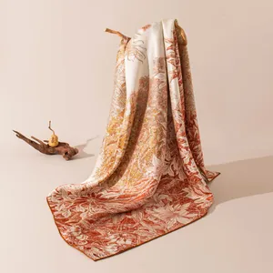 Elegant mulberry silk square scarf with orange botanical print on snowflake satin.
