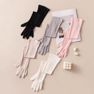 Detailed view of elegant long mulberry silk sunscreen gloves in five assorted colors