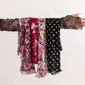 Detailed view of various patterned mulberry silk arm sleeves for women's sun protection