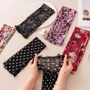 Detailed view of elastic mesh silk sun protection sleeves with various patterns