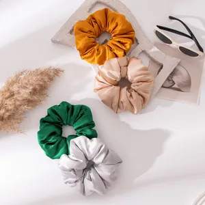 Elegant silk satin hair scrunchies set in assorted solid colors for stylish ponytail holders