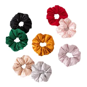 Set of multicolored silk satin scrunchies for hair ties in various elegant shades.