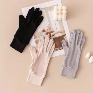 Close-up detail of thin breathable mulberry silk sun protection gloves in three colors