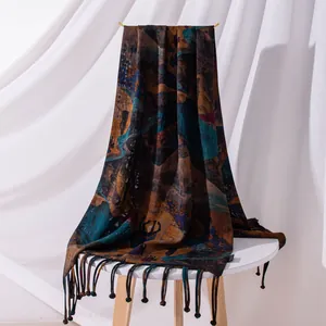 Premium Xiangyun silk scarf featuring an abstract artistic print and long knotted tassels