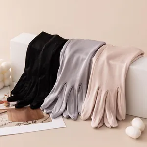 Variety of thin mulberry silk sun protection gloves in black, grey, and nude for summer use.