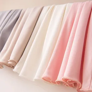 Macro detail of soft pastel mulberry silk fabric textures for sun protection masks