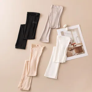 Detail of knitted silk sun protection arm sleeves in multiple elegant colors.