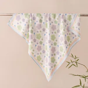 Elegant detail of a spring floral print square scarf draped over a minimalist rod
