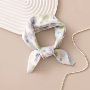 Detailed view of elegant floral print on a lightweight square silk neckerchief scarf