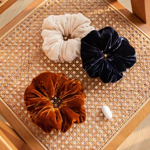 Set of three vintage velvet hair scrunchies in cream, navy blue and rust orange