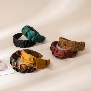 Detailed macro shot showcasing the rich silk texture of vintage style pleated headbands