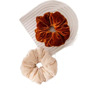 Set of two elegant vintage velvet scrunchies in brown and cream beige for women's hair