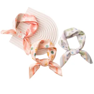 Three elegant floral square silk scarves in pastel pink, apricot and light blue colors