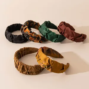 Collection of vintage silk satin headbands with floral and solid color patterns