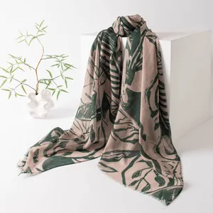 Close-up of vintage botanical print scarf draped over a white geometric display