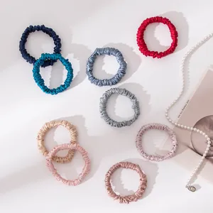 Detailed view of small 1cm mulberry silk hair scrunchies in various elegant colors