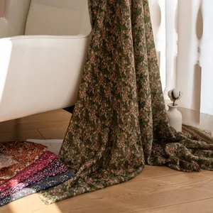 Close-up of lightweight vintage floral scarf draped elegantly in a warm sunlit room.