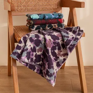 Vintage purple abstract print long scarf shawl elegantly displayed on a wooden chair