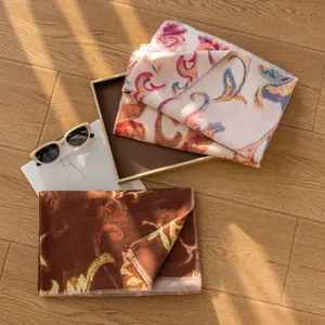 Elegant printed scarves for women in cream and brown with floral patterns