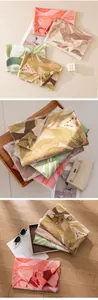 Close-up of elegant floral print scarves with soft textures in natural light