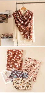 Detailed view of various leopard print scarves for the autumn and winter season