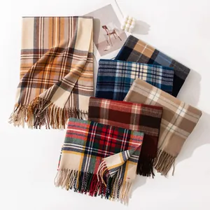Selection of cozy colorful plaid scarves with tassels in soft imitation cashmere texture