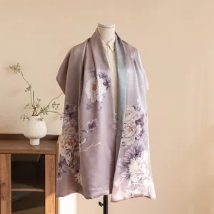 Elegant double-layered silk shawl with traditional Chinese floral pattern on mannequin view