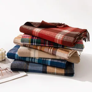 Stack of premium plaid cashmere-feel winter scarves in various colorful patterns