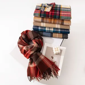 Close-up detail of assorted classic plaid scarves featuring warm imitation cashmere texture