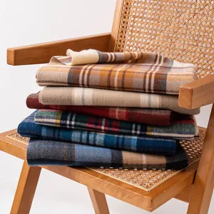 Detailed stack of soft imitation cashmere plaid winter scarves in various classic patterns