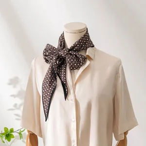 Elegant brown geometric print silk scarf for professional office wear shown on mannequin
