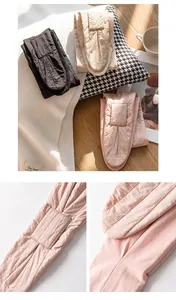 Close-up detail of quilted pink neck warmer with silk filling texture