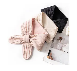 Trio of lightweight quilted silk-filled triangle scarves in pink, cream, and black colors