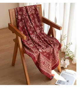 Detailed view of luxury red silk wool shawl with intricate double-sided geometric patterns
