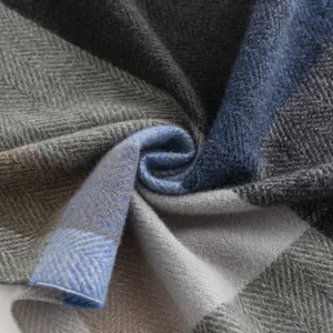 Soft men's faux cashmere scarf featuring a blue and gray herringbone pattern weave detail