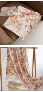 Elegant floral print cashmere-feel scarf with fringe, pink blossoms on cream background.