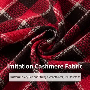 Close-up of thick red and black vintage plaid cashmere-like scarf fabric texture