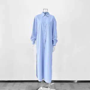 Front view of light blue long-sleeved shirt dress with pointed collar and side slits