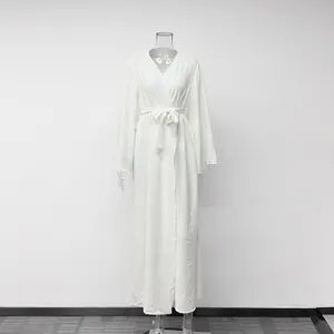 Detail shot of elegant white textured wrap maxi dress loungewear on a mannequin