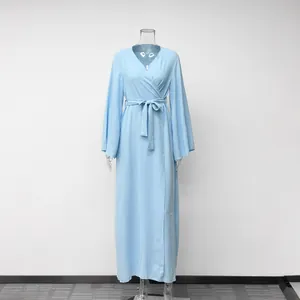 Elegant light blue long-sleeved wrap maxi dress featuring flare sleeves and a waist belt