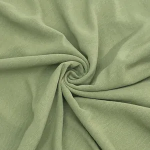 Detailed close-up showing the soft texture and drape of sage green fabric for women dresses