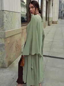 Elegant sage green long cardigan dress with wide sleeves for minimalist autumn fashion