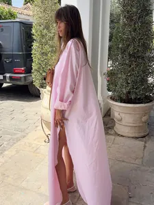 Side view of long pink shirt dress with side slit for vacation